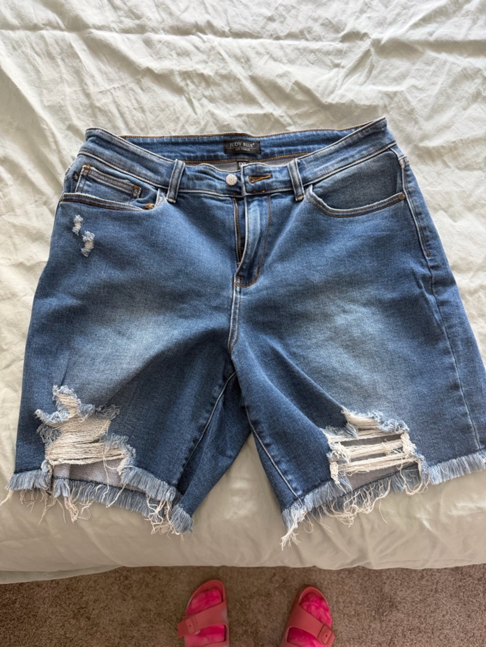 Judy Blue distressed medium blue denim shorts with frayed hem